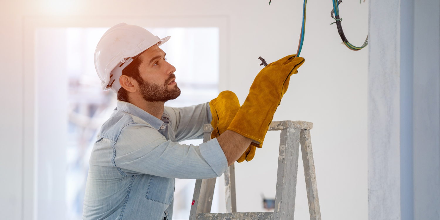 Electrician working on new home build - Hire an 'LEC' - It's the Law