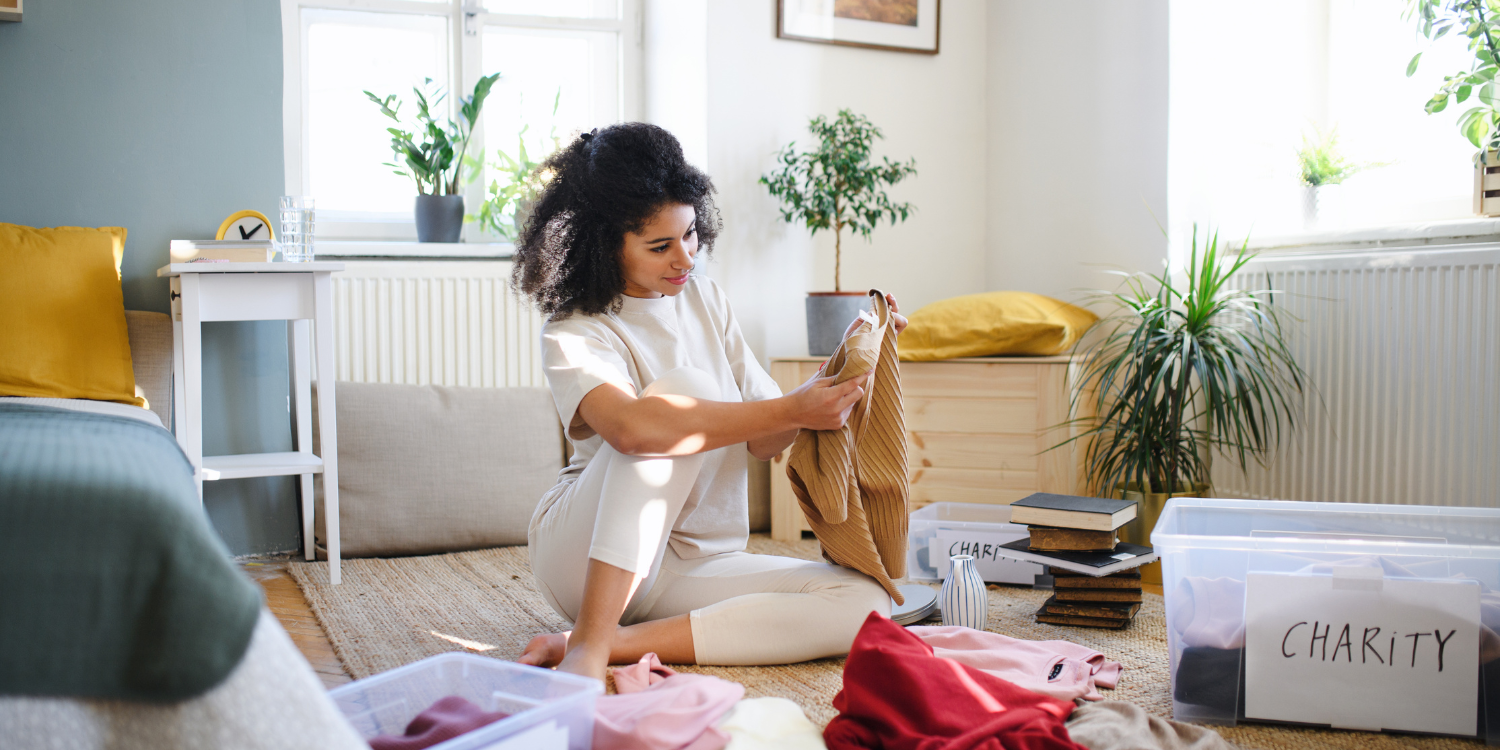 Woman going through the process of decluttering - Increase the Value of Your Home