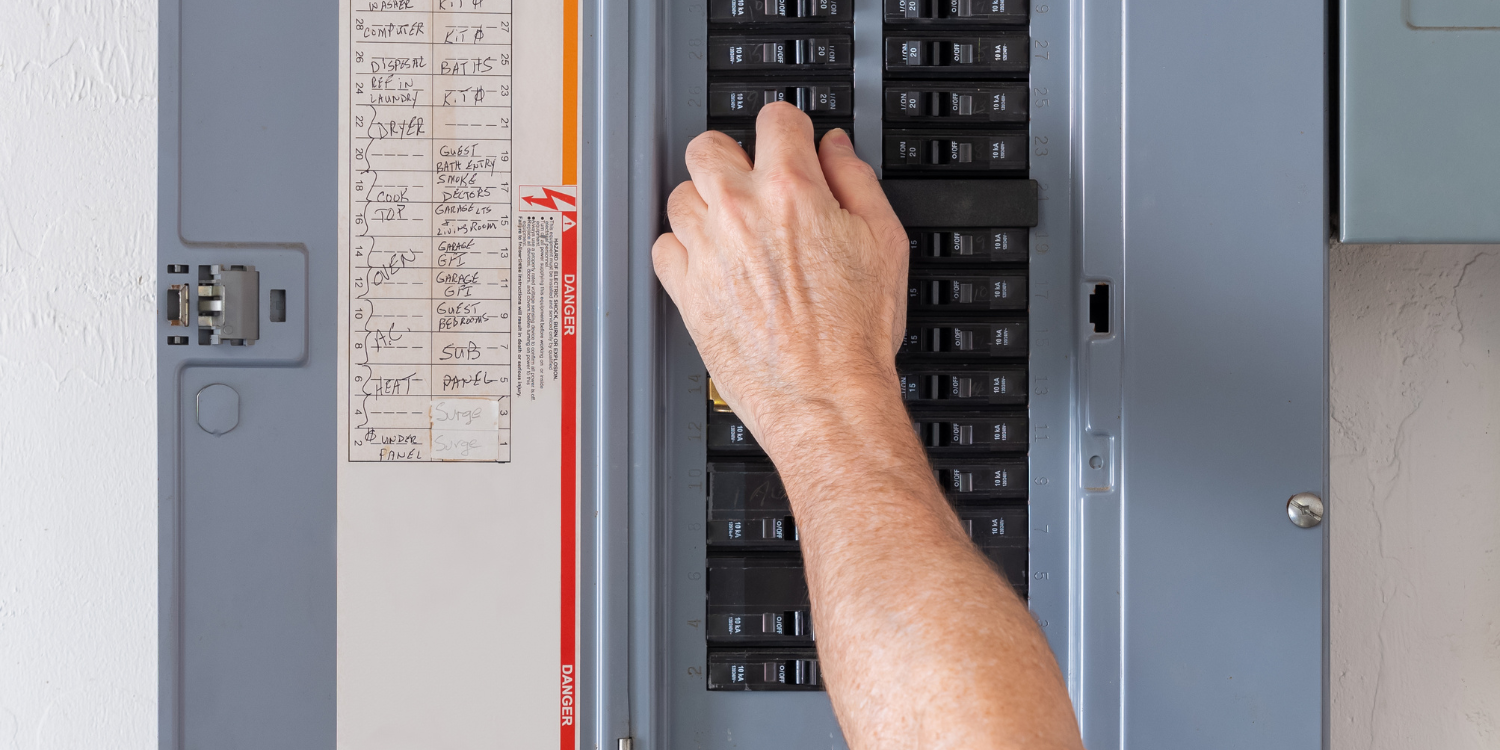 Contractor working on breaker panel - A Fuse to Breaker Panel Upgrade May Be Just What Your Home Needs